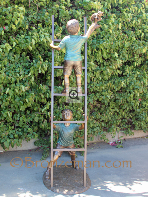 bronze statue of boys on a ladder