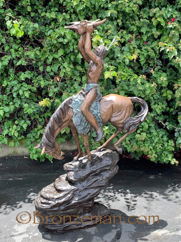 bronze statue of indian on horse