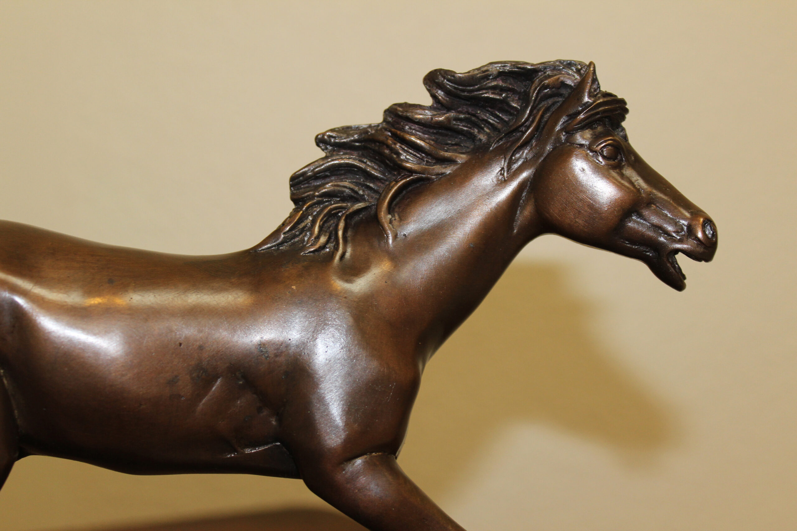 bronze statue of horse running