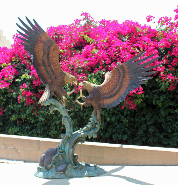 bronze statue of two eagles fighting
