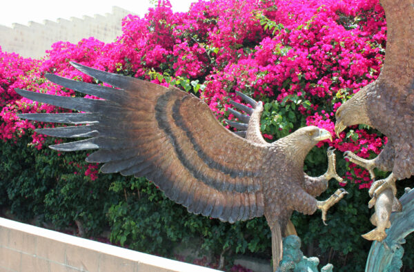 bronze statue of two eagles fighting