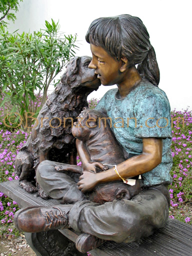 bronze statue of a girl and dog