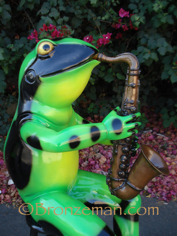 bronze jazz playing frog
