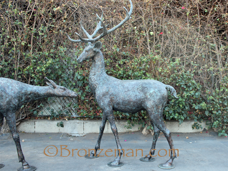 Bronze buck an doe statues