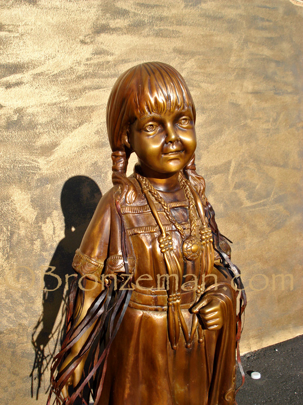 bronze statue of a native american girl