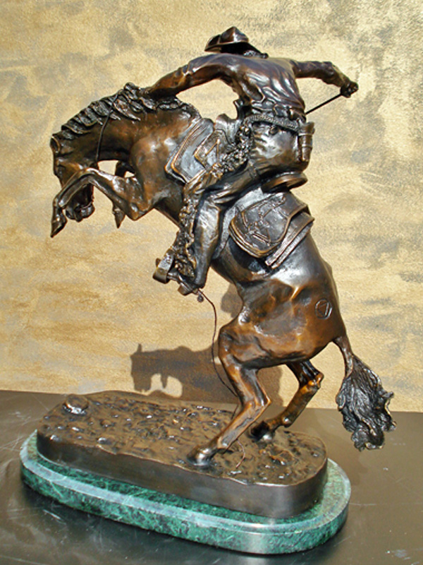 bronze remington wooly chaps statue
