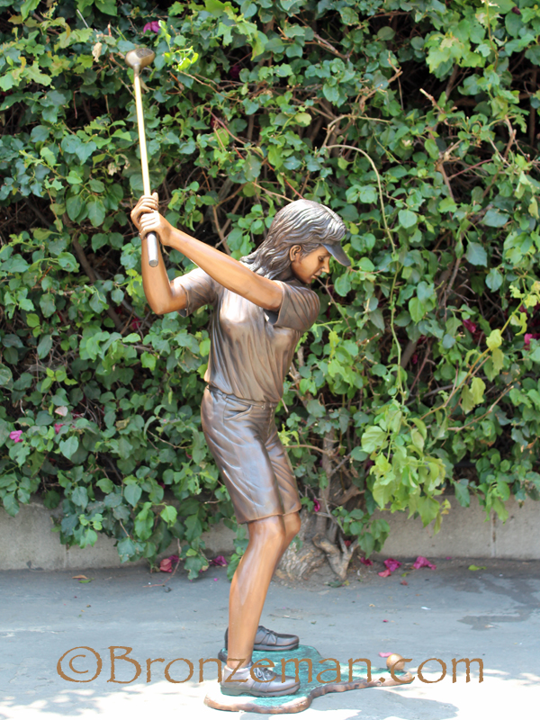 bronze girl golfer statue