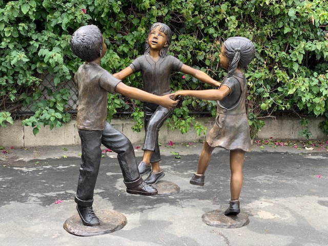 Bronze Statue of 3 Kids Holding Hands