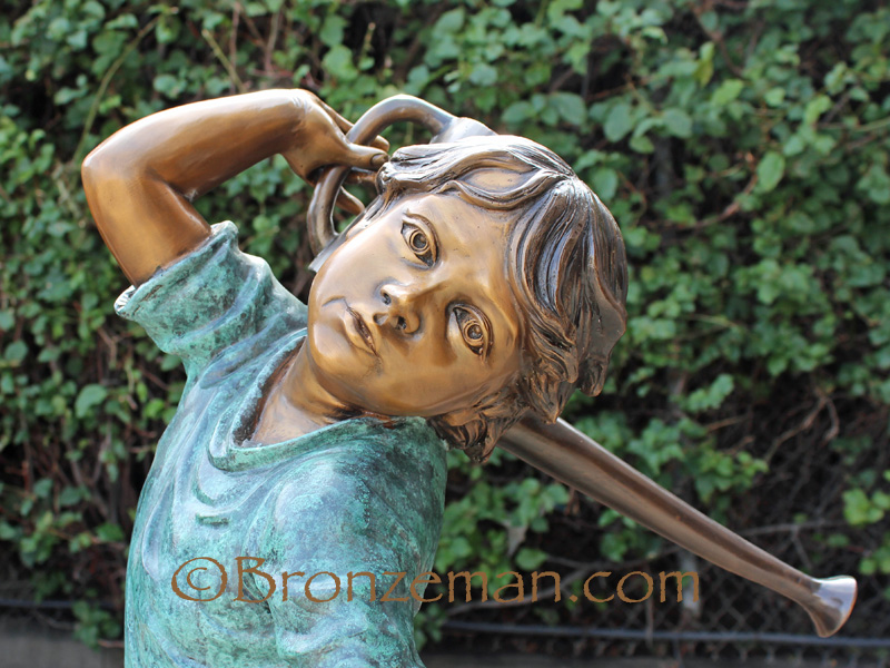 boy statue of a boy with a watering can