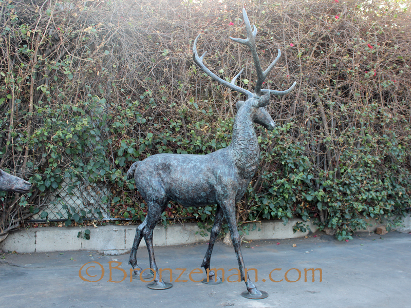 Bronze buck an doe statues