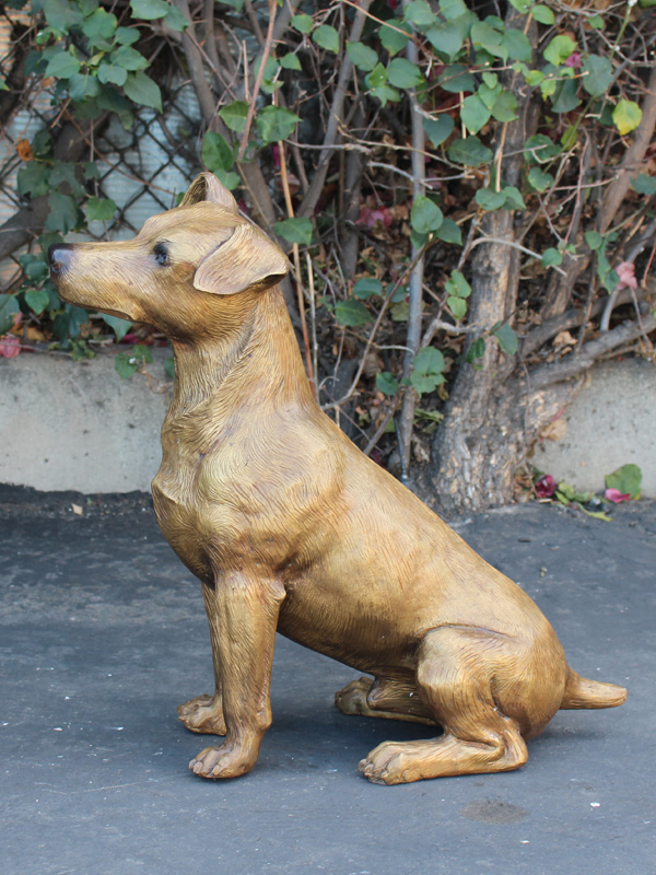 bronze dog head tilted