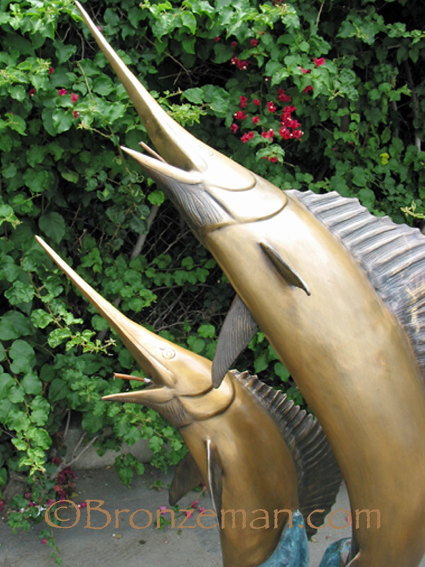 bronze statue of two sailfish
