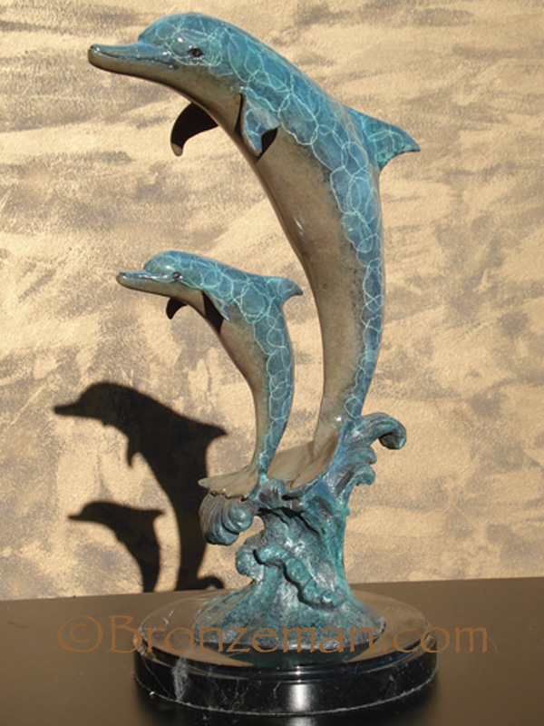 bronze statue of 2 dolphins