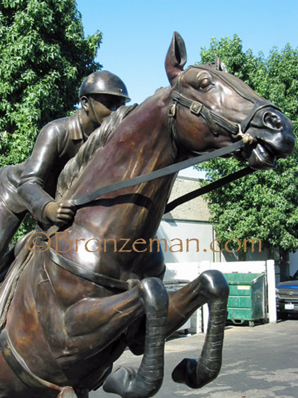 bronze horse jumping statue