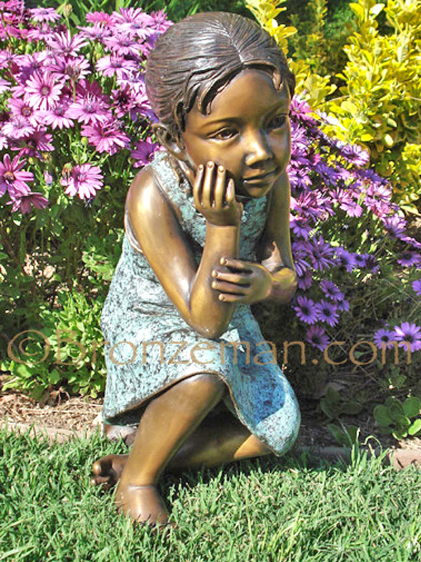 bronze children statue of a girl