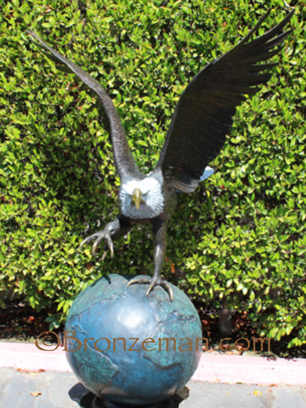 bronze eagle on globe