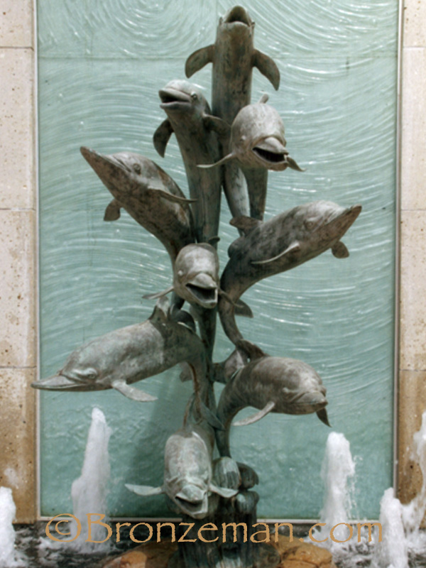 bronze fountain statue of dolphins