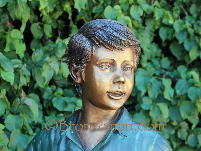 bronze statue of children walking