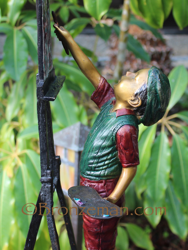 Bronze statue of boy painting