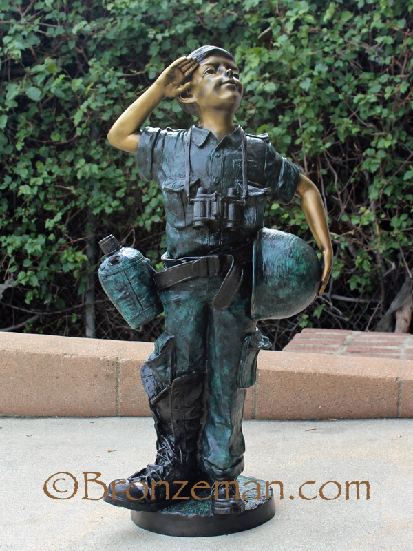 bronze statue of boy saluting