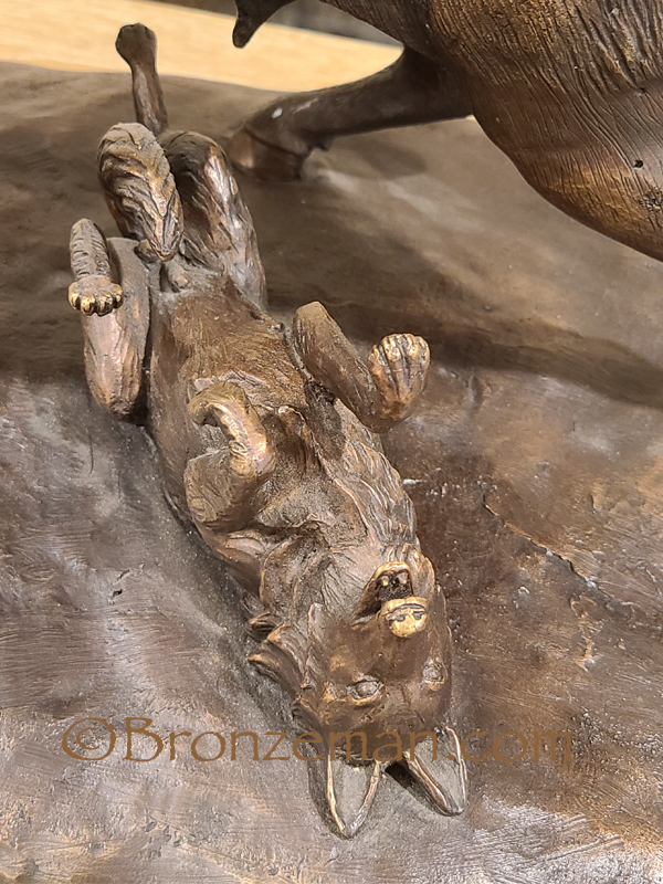 Bronze bison statue with wolves