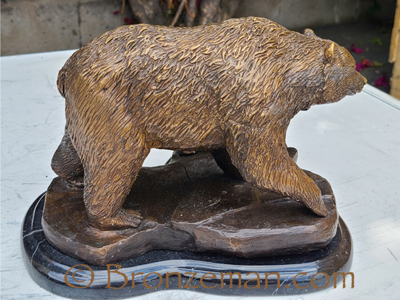 bronze bear statue with cub
