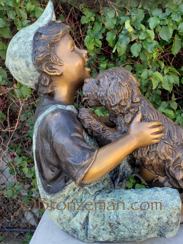 boy and dog bronze statue
