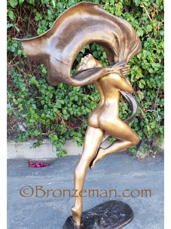 bronze woman dancing statue