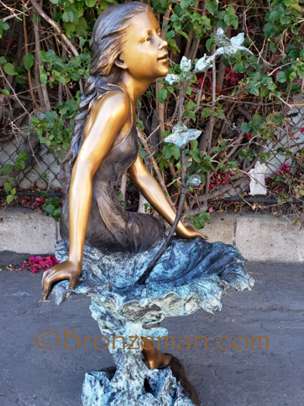 bronze statue girl on birdbath