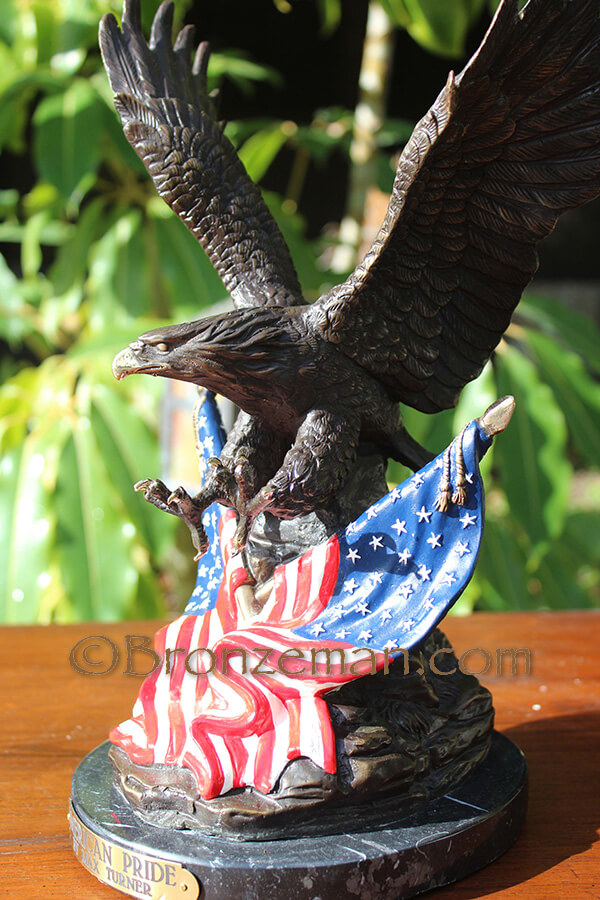 bronze eagle with american flag