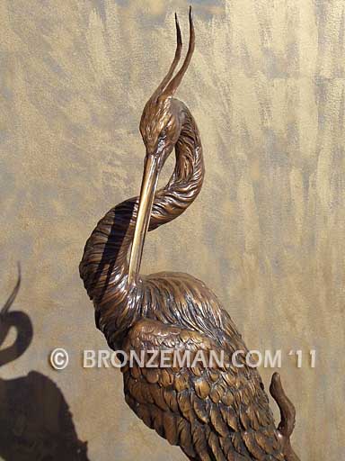 bronze heron statue