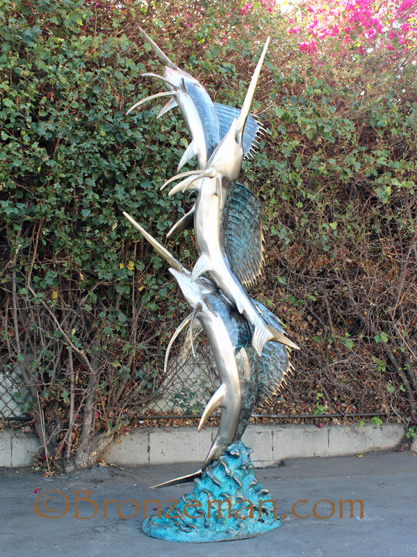 bronze statue of three sailfish
