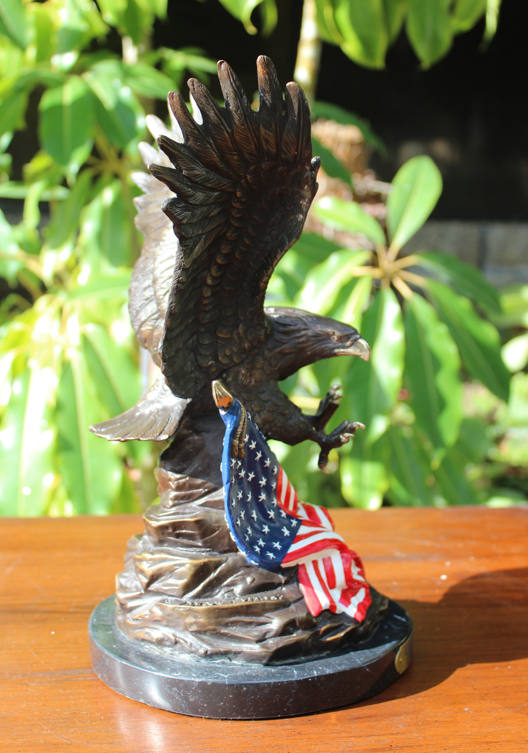 bronze eagle with american flag