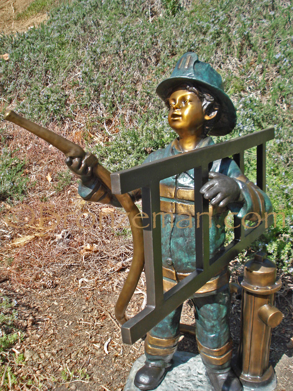 bronze statue of boy firefighter
