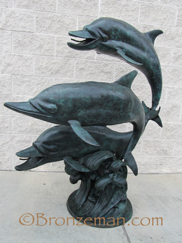 bronze dolphins statue