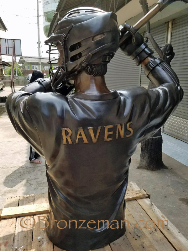 custom bronze statue of a lacrosse player