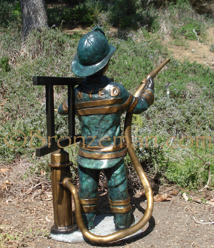 bronze statue of boy firefighter