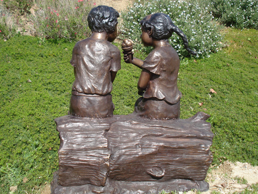 bronze statue of children sharing ice cream