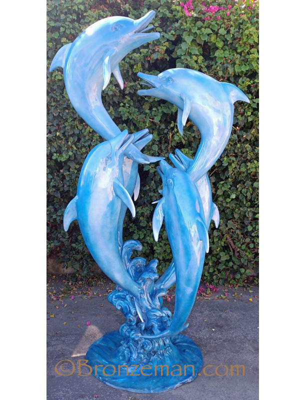 bronze statue of dolphins playing
