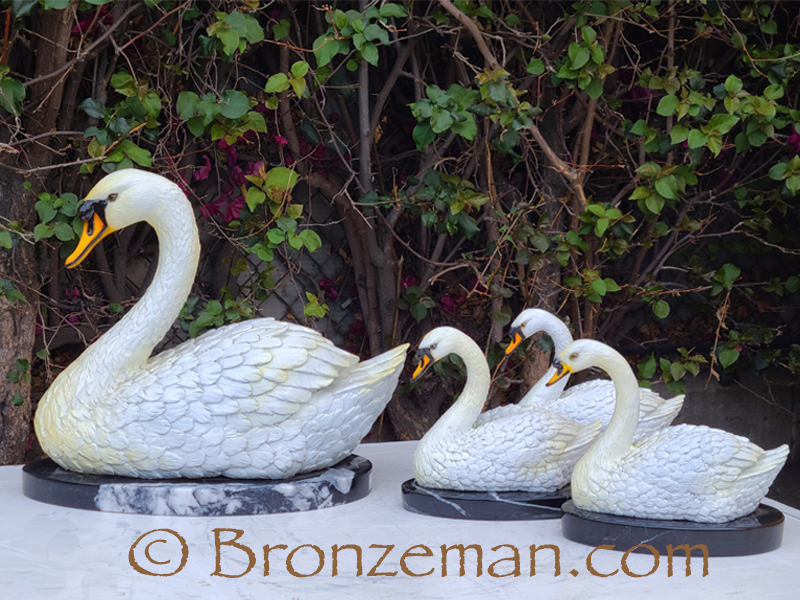 bronze statue of swans