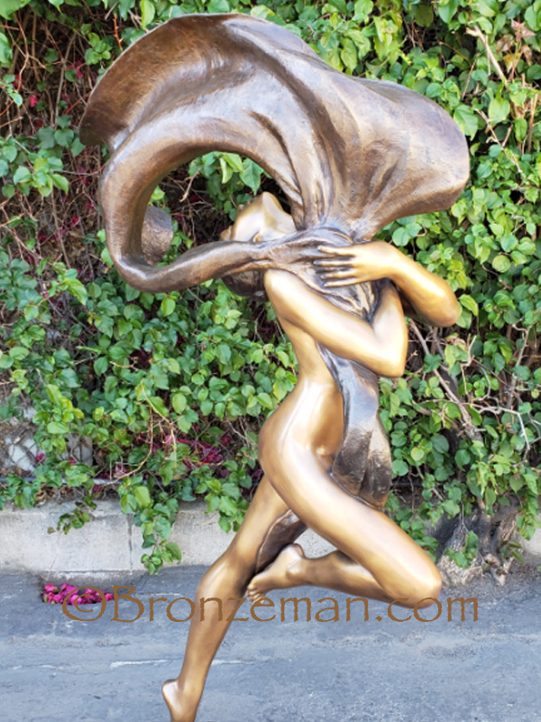 bronze woman statue dancing