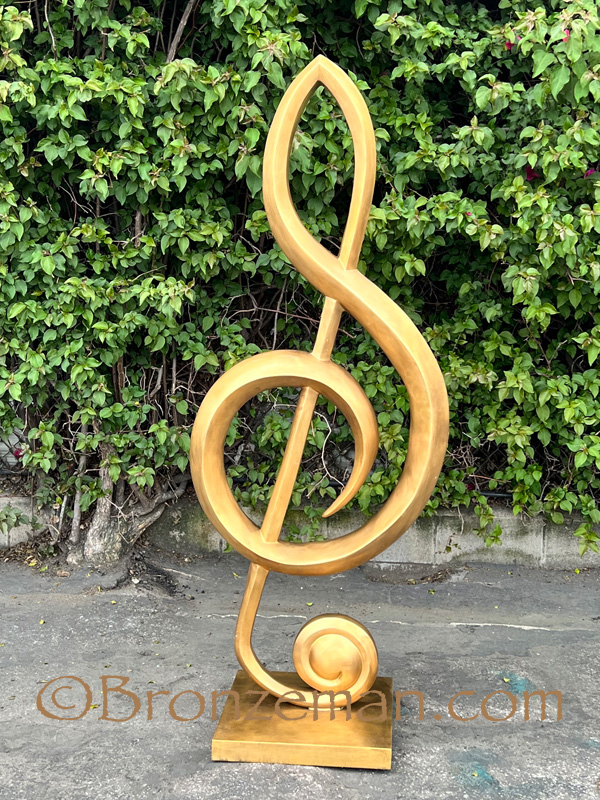 bronze statue of a treble clef